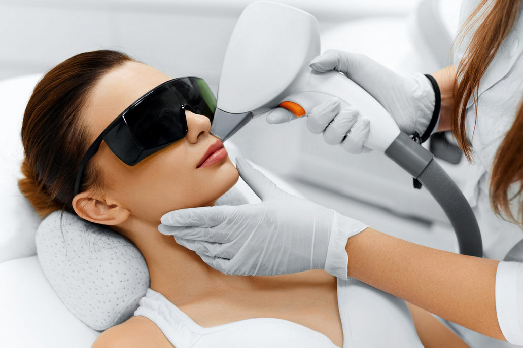 image of woman wearing glasses and having laser on her upper lips